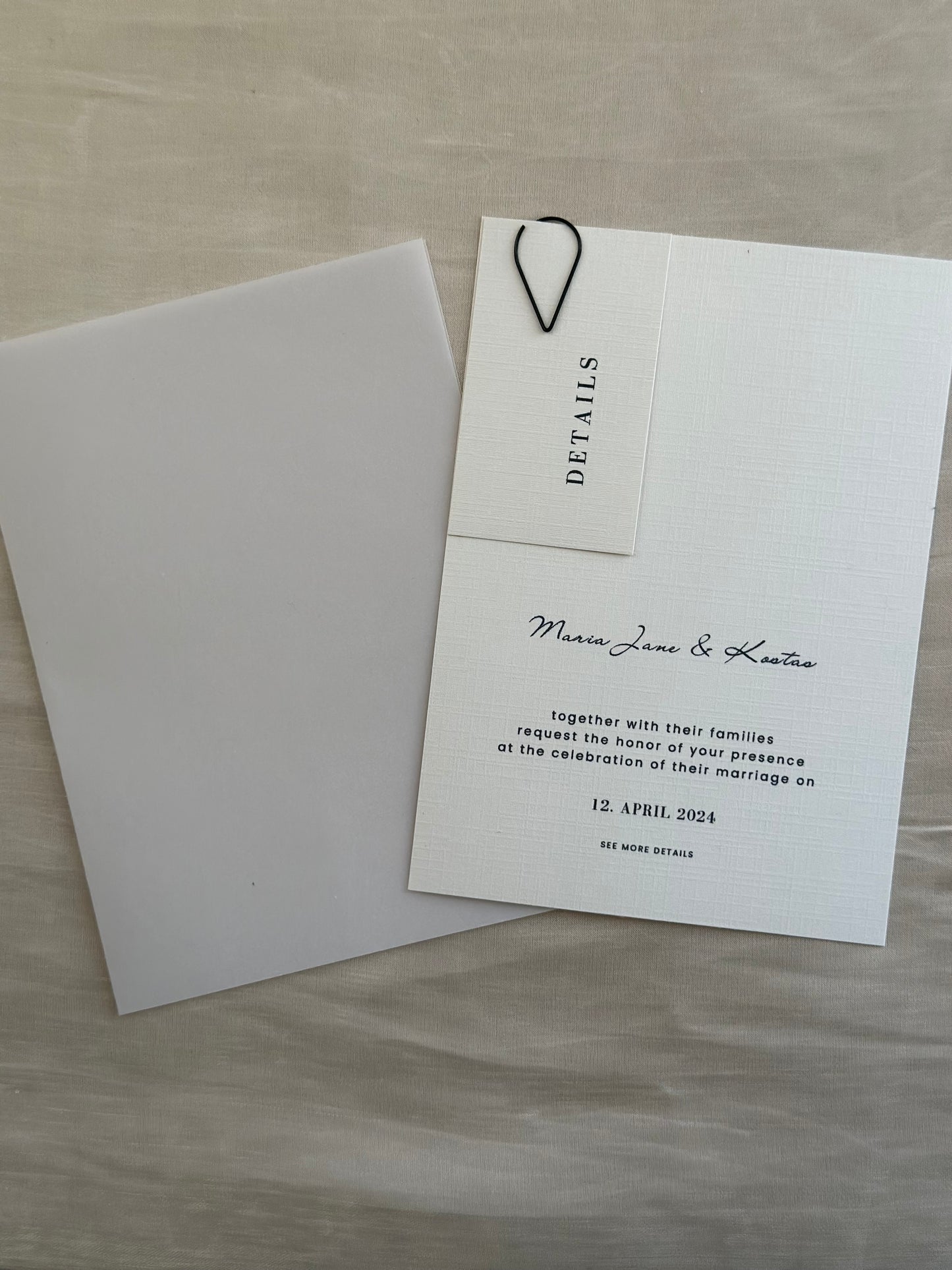 Invitation card with decorative paperclip