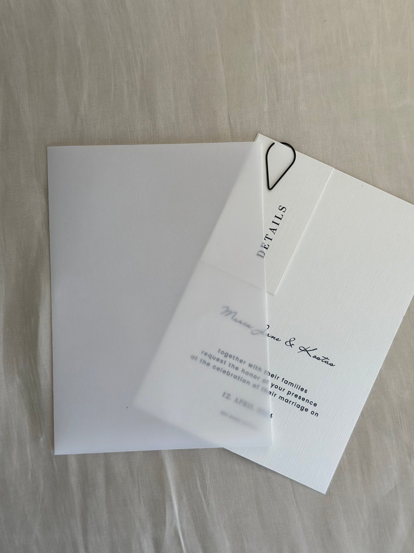 Invitation card with decorative paperclip