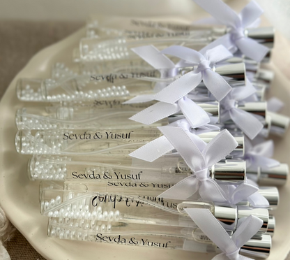 Cologne spray bottles favors with pearls.