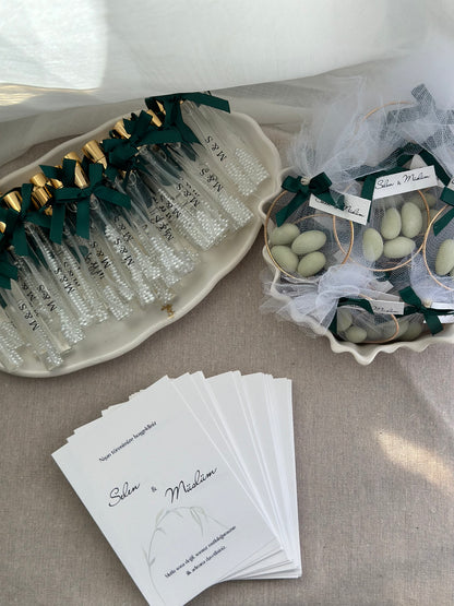 Cologne spray bottles favors with pearls.