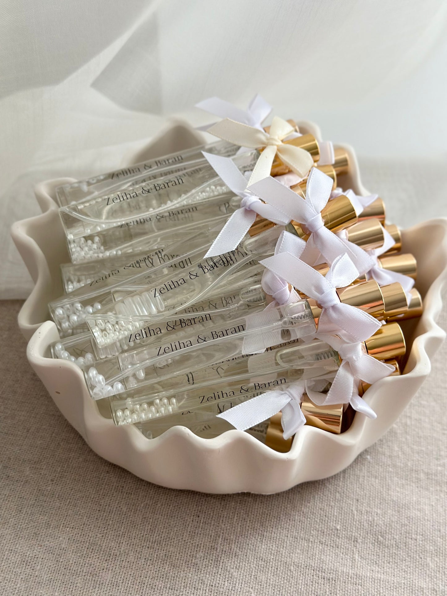 Cologne spray bottles favors with pearls.