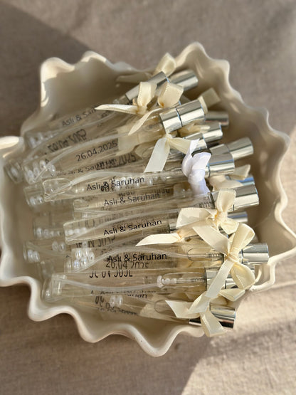 Cologne spray bottles favors with pearls.