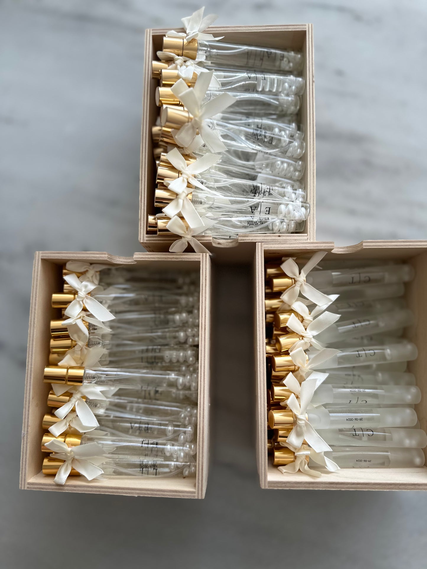 Cologne spray bottles favors with pearls.