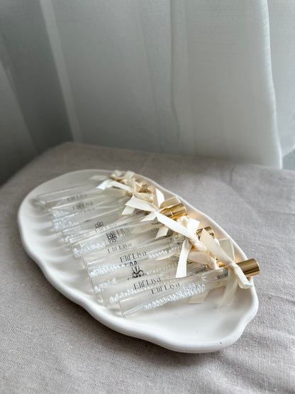 Cologne spray bottles favors with pearls.