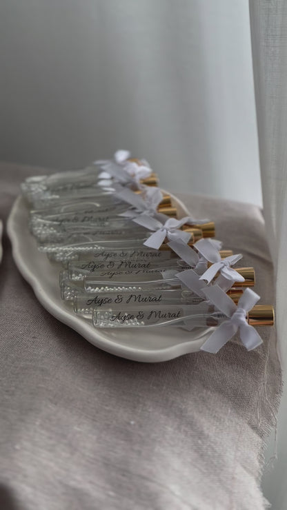 Cologne spray bottles favors with pearls.